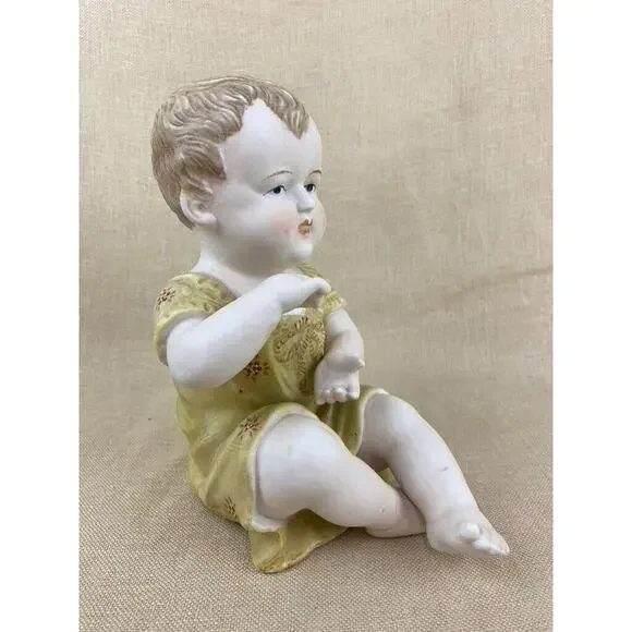 Vintage Bisque Porcelain Piano Baby Figurine 7”